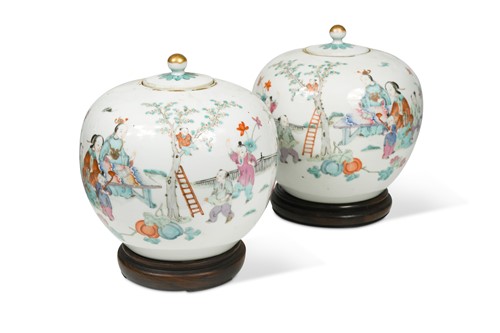 Lot 5 - A pair of Chinese famille rose porcelain ovoid vases and covers, late Qing Dynasty