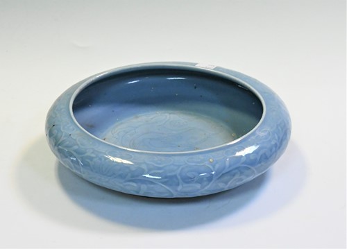Lot 51 - A Chinese clair- de- lune glazed and carved shallow bowl, late Qing Dynasty, circa 1910