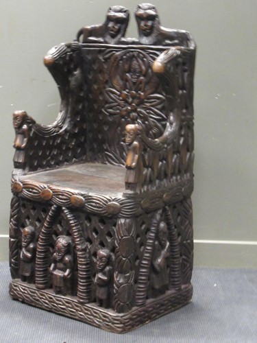 Lot 173 - A Bamileke throne chair, profusely carved with...