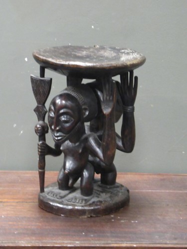 Lot 159 - A Luba Hemba carved stool, the circular top...
