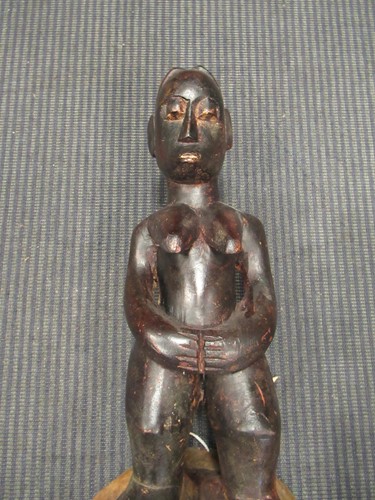 Lot 162 - A Guro mask with a red painted feminine face...