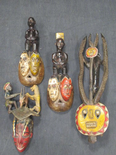 Lot 162 - A Guro mask with a red painted feminine face...