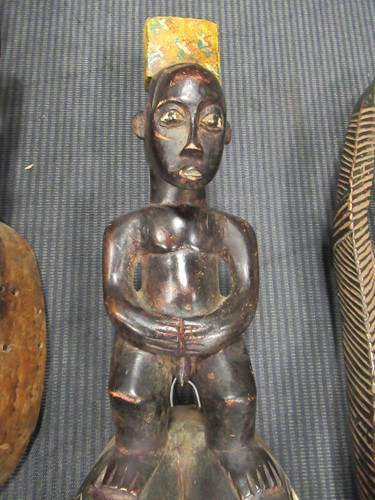 Lot 162 - A Guro mask with a red painted feminine face...
