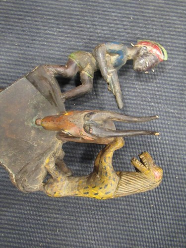 Lot 162 - A Guro mask with a red painted feminine face...