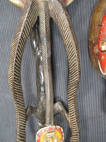 Lot 162 - A Guro mask with a red painted feminine face...