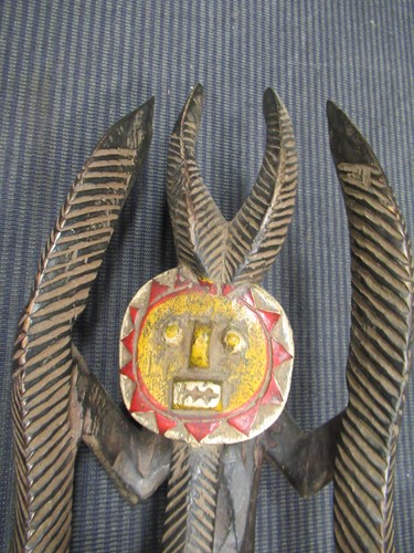 Lot 162 - A Guro mask with a red painted feminine face...