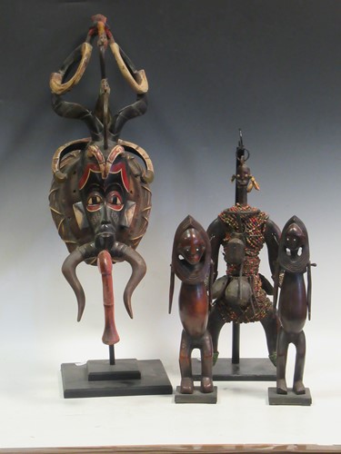 Lot 127 - A pair of Nyamwezi carved wood figures with...