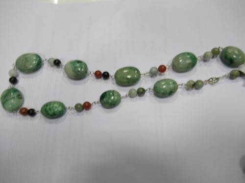 Lot 328 - Two strings of maw sit sit beads, 20th century,...