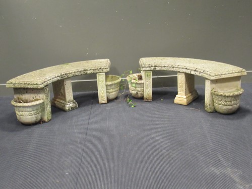 Lot 580 - A pair of composite stone curved garden...