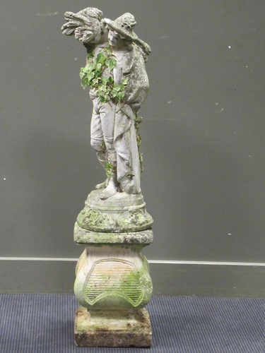 Lot 626 - A composite stone garden figure carrying his...