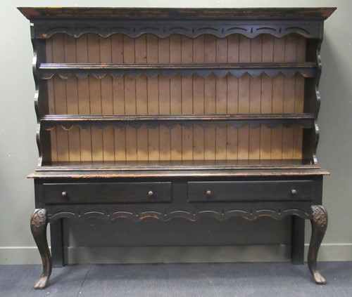 Lot 546 - A black painted dresser, with two shelved...