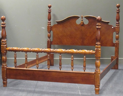Lot 547 - A modern bed with arched head board and turned...