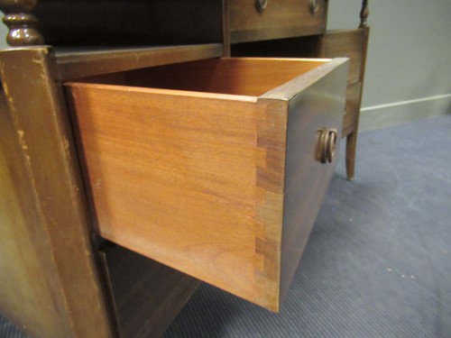 Lot 528 - A 20th century curved writing desk with green...
