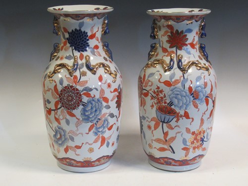 Lot 69 - A pair of two-handled imari vases, mounted...