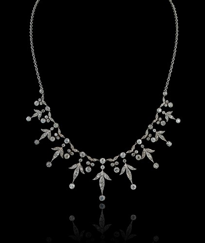 Lot 205 - An Edwardian diamond fringe style centrepiece with a later chain