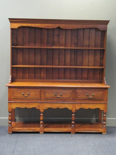 Lot 551 - A reproduction 18th century style oak dresser,...