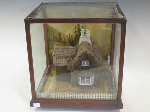 Lot 20A - Diorama of a Swiss cottage in a glazed case,...