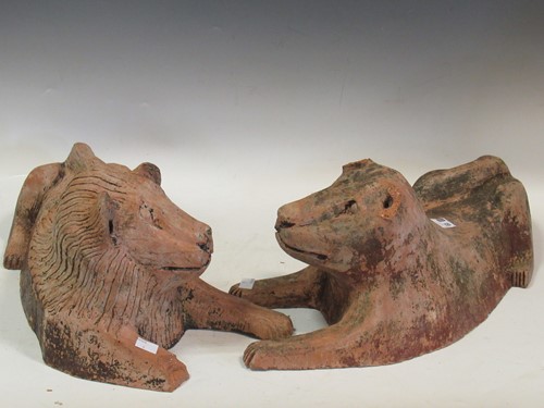 Lot 620 - A pair of terracotta models of a lion and...