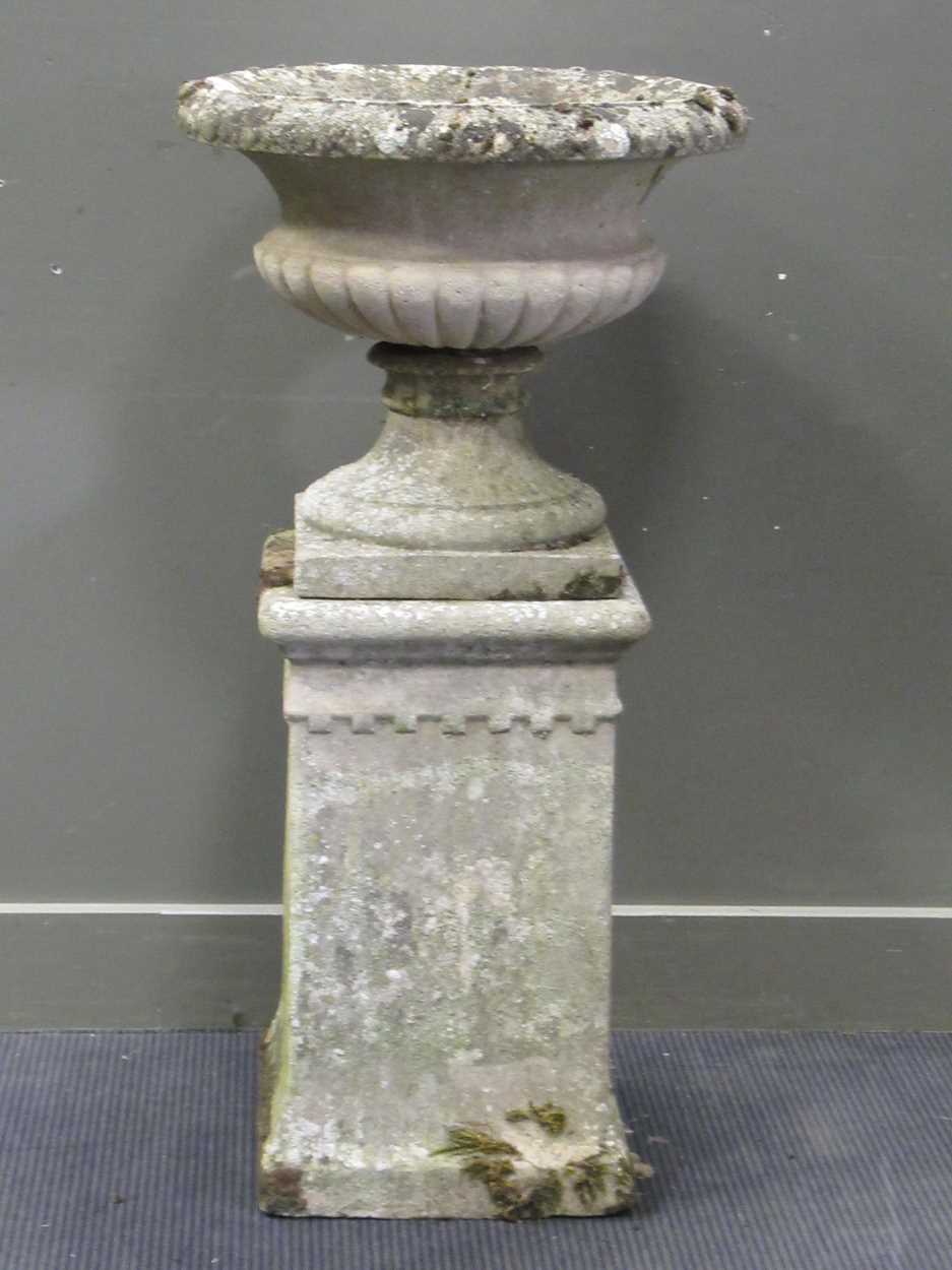 Lot 628 - A garden urn on stand, 110cm high