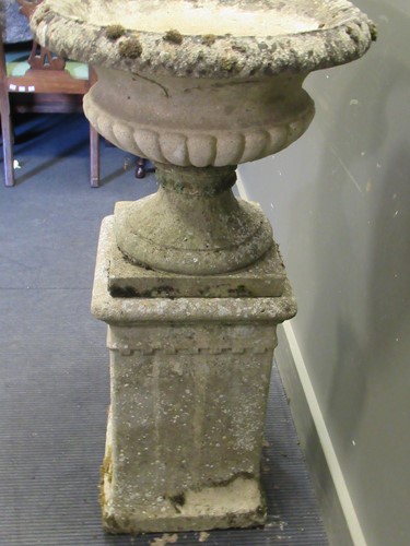 Lot 628 - A garden urn on stand, 110cm high