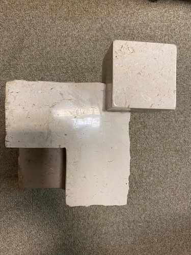 Lot 119 - A carved and polished marble brutalist sculpture
