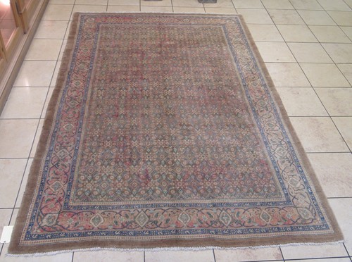 Lot 637 - A Ferghan carpet with a sand coloured field...