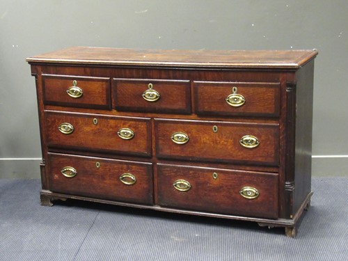 Lot 526 - A George III oak dresser base with arrangement...