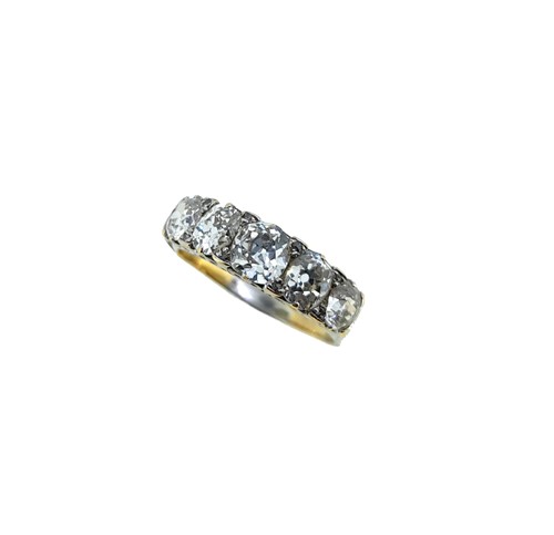 Lot 91 - A carved half hoop style diamond ring
