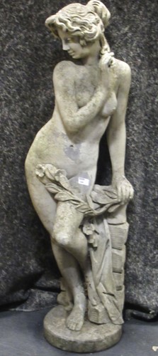 Lot 546 - A composite garden statue of classical female...