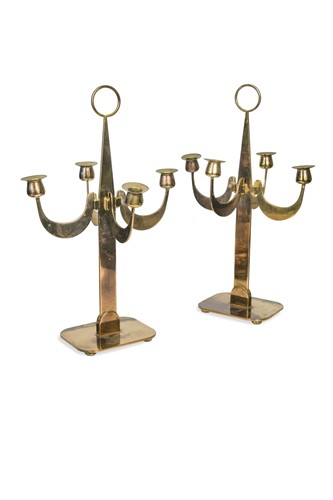 Lot 177 - A pair of mid-century brass four branch candelabra