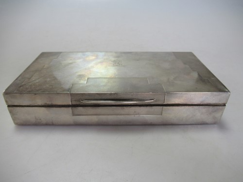 Lot 218 - An Art Deco style silver table cigarette box,...