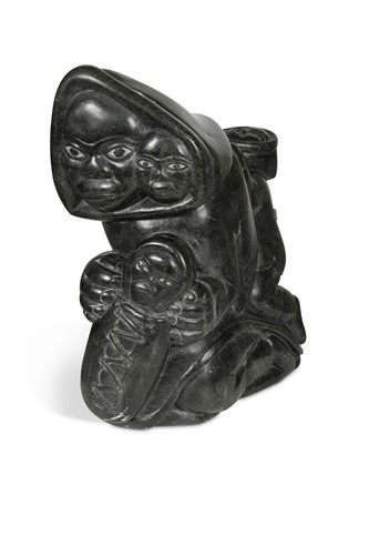 Lot 117 - An Inuit carved stone figure of a mother with her children