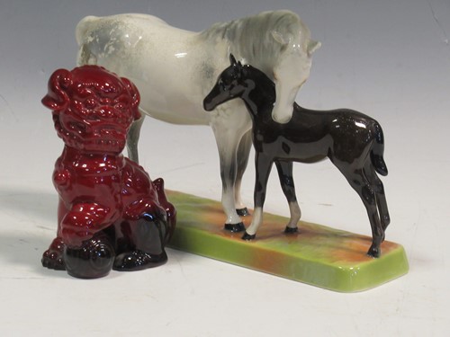 Lot 73 - A Royal Doulton flambe fo-dog and a Beswick...
