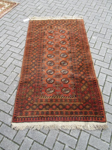 Lot 552 - A hand-woven Afghan rug