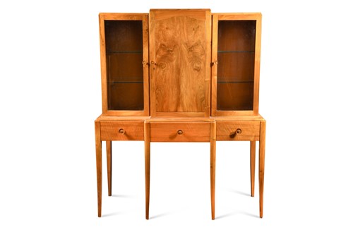 Lot 244 - Attributed to Gordon Russell, an Art Deco walnut breakfront cabinet