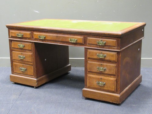 Lot 373 - An Edwardian oak twin pedestal desk with inset...