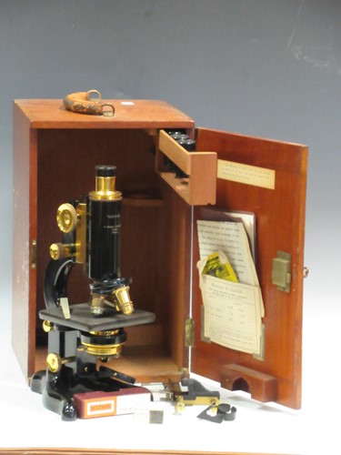 Lot 277 - A mahogany cased microscope