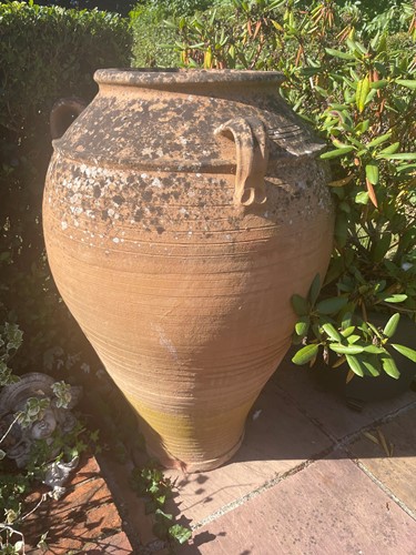Lot 970 - A pair of terracotta olive jars, 20th century