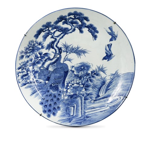 Lot 180 - A Japanese blue and white porcelain large peacock charger, late Meiji Period (1868-1912)