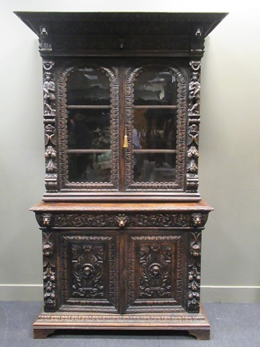 Lot 450 - A 19th century Flemish oak cabinet, the upper...