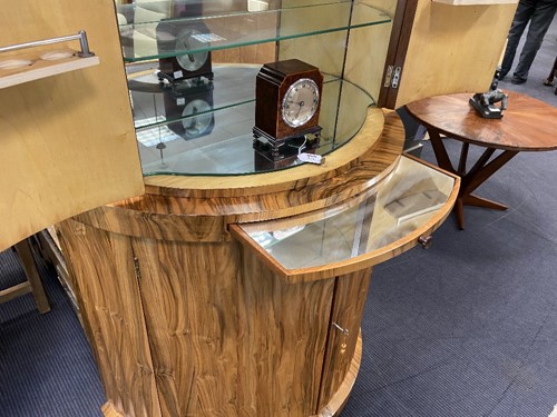 Lot 251 - Attributed to Harry & Lou Epstein, an Art Deco figured walnut demi-lune cocktail cabinet, circa 1930