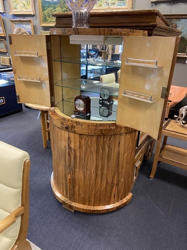 Lot 251 - Attributed to Harry & Lou Epstein, an Art Deco figured walnut demi-lune cocktail cabinet, circa 1930