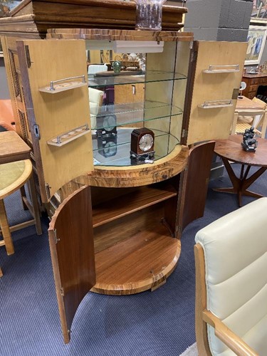 Lot 251 - Attributed to Harry & Lou Epstein, an Art Deco figured walnut demi-lune cocktail cabinet, circa 1930