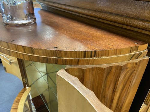 Lot 251 - Attributed to Harry & Lou Epstein, an Art Deco figured walnut demi-lune cocktail cabinet, circa 1930