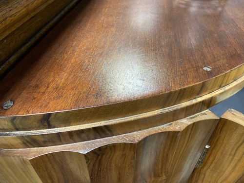 Lot 251 - Attributed to Harry & Lou Epstein, an Art Deco figured walnut demi-lune cocktail cabinet, circa 1930