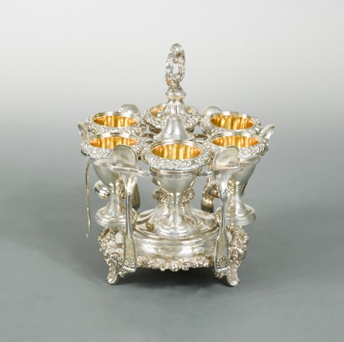 Lot 390 - A George III silver egg cruet for 6 with additional spoons