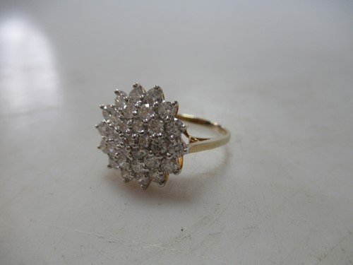 Lot 182 - A 9ct gold diamond cluster ring, total diamond...