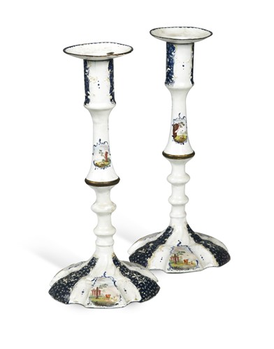 Lot 410 - A pair of South Staffordshire metal mounted enamel candlesticks, circa 1770
