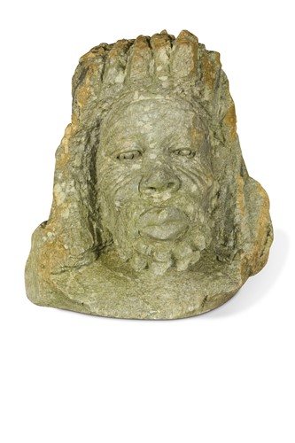 Lot 722 - A carved stone mask of a bearded man, possibly 19th century or earlier