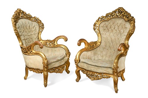 Lot 909 - A pair of carved giltwood throne chairs, 20th century